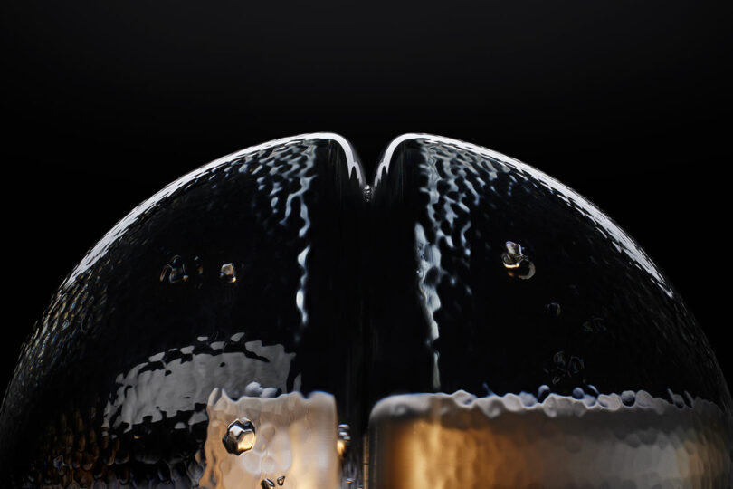 Close-up of two textured, reflective, dome-shaped surfaces with a dividing line, illuminated against a dark background—evoking the elegant design of Bocci 14p.