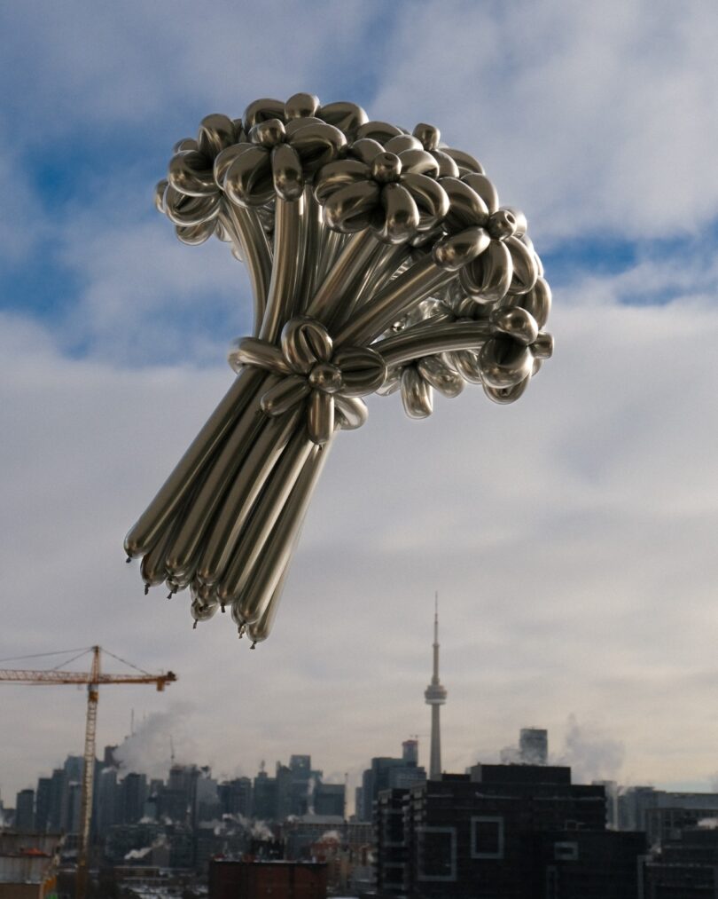 metallic silver balloon flower bouquet with CN Tower in the background, Toronto.