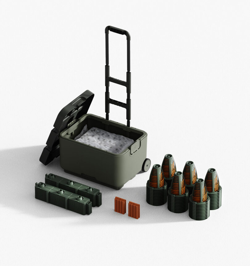A green rolling cooler with its lid open is surrounded by multiple stacked plastic objects and two rectangular brown blocks on a white background.