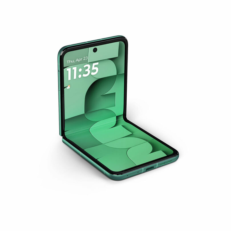 A green flip phone is partially open, displaying the time 11:35 and date Thursday, April 23 on its screen, with a geometric green design as the wallpaper.