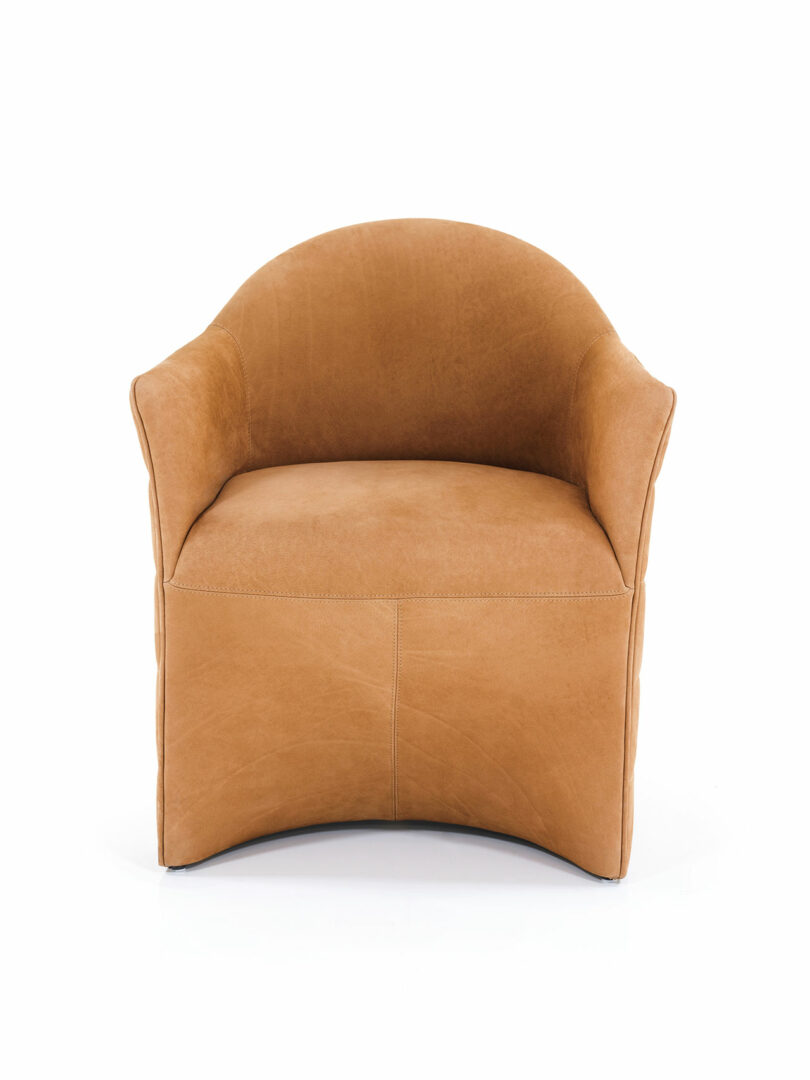 A tan leather Wittmann armchair with a curved backrest and armrests, viewed from the front against a white background.